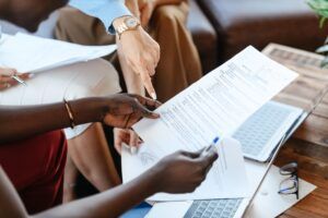 Two People Reviewing Paperwork Together