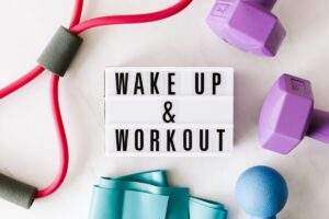 Wake Up and Workout Sign With Exercise Equipment